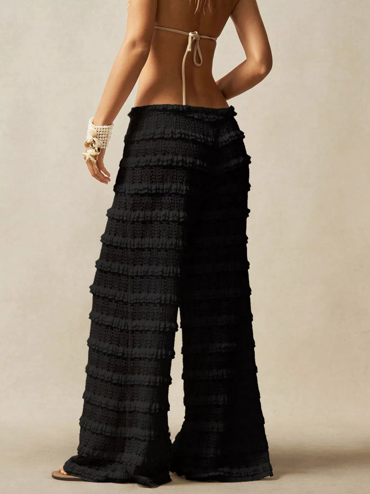 Black lace pants fabric close up
