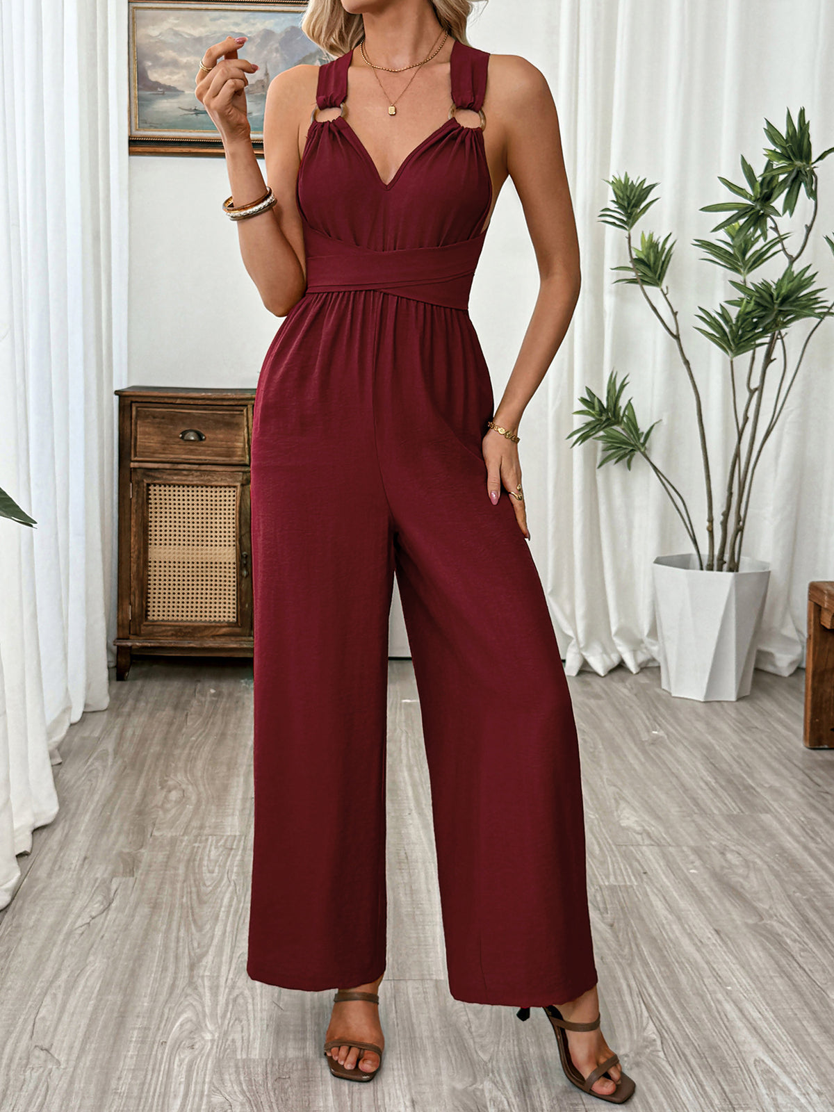 Back view of the sleeveless burgundy jumpsuit