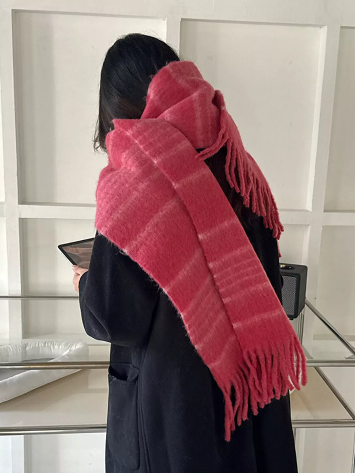 Cozy striped fringe scarf laid flat to show length