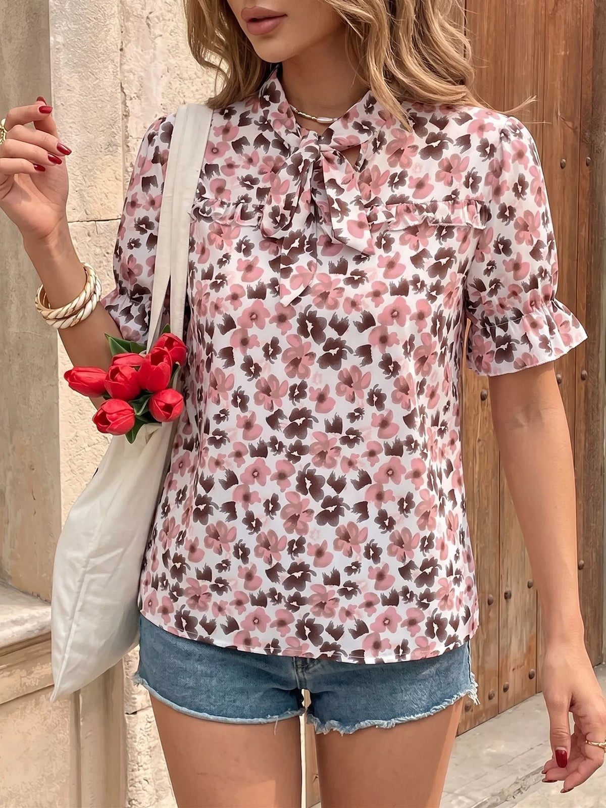 Pink floral tie neck ruffle blouse side view