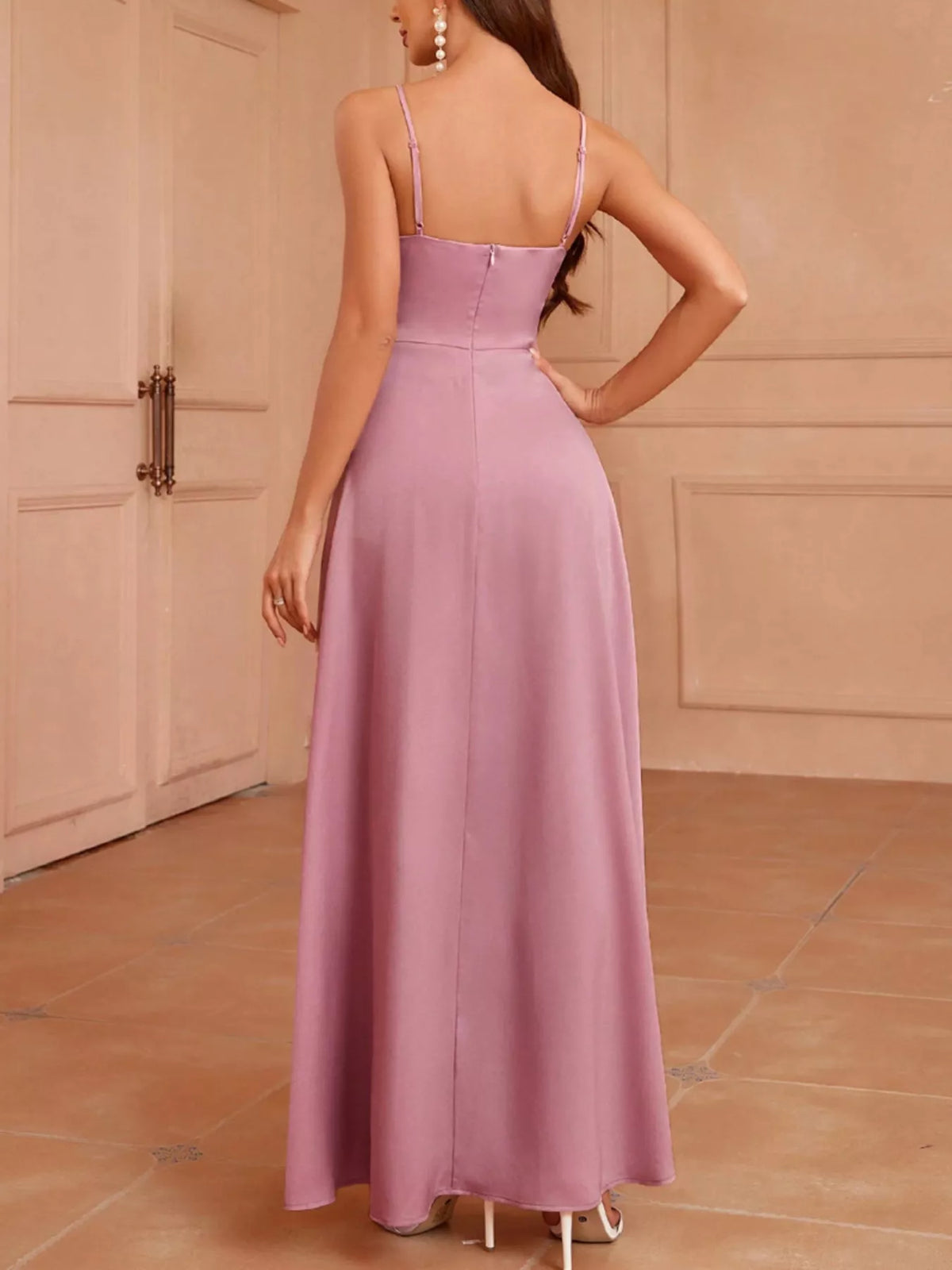 Full length styling view of the slit spaghetti strap maxi dress
