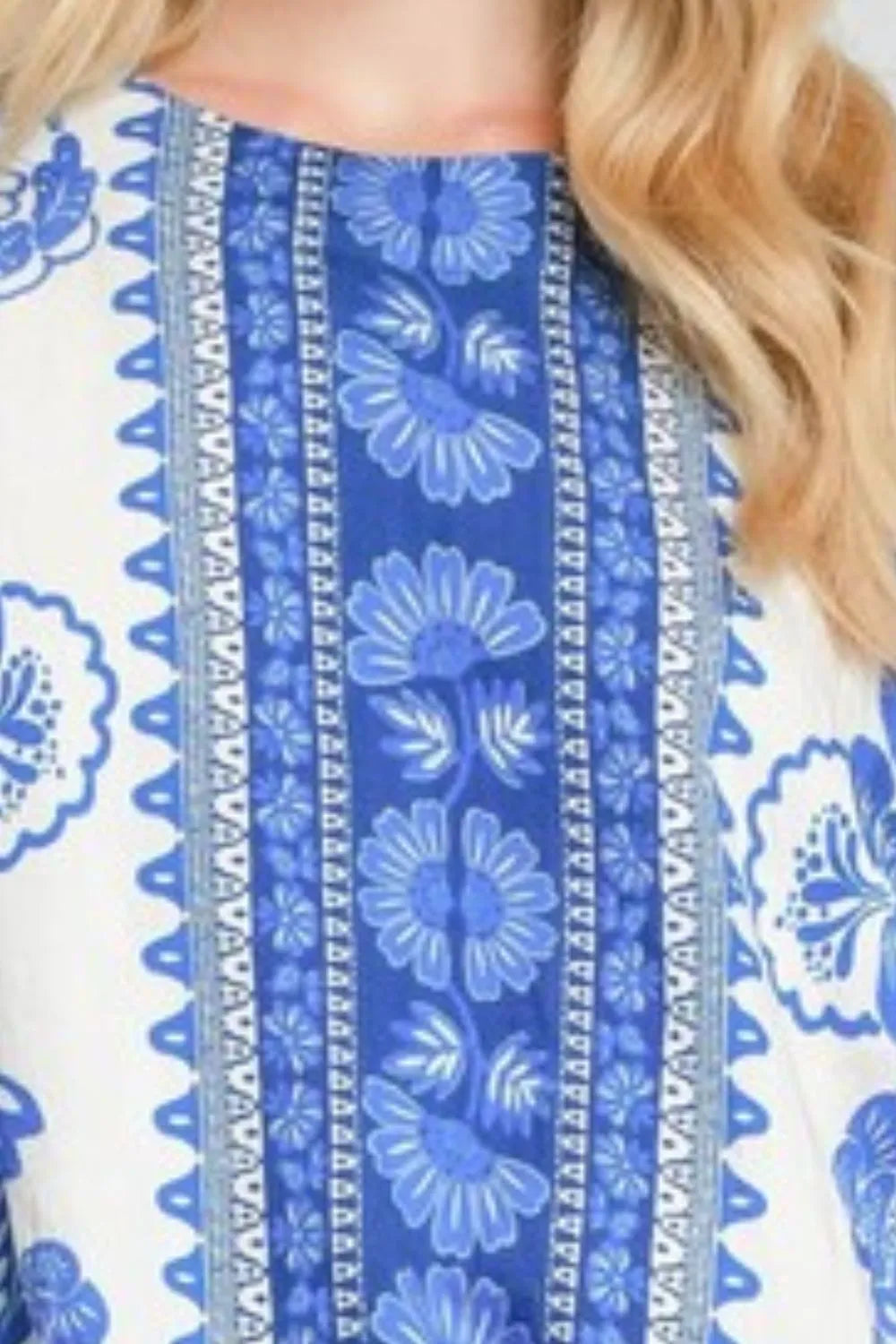 Oversized floral border print top plus size hem print close up