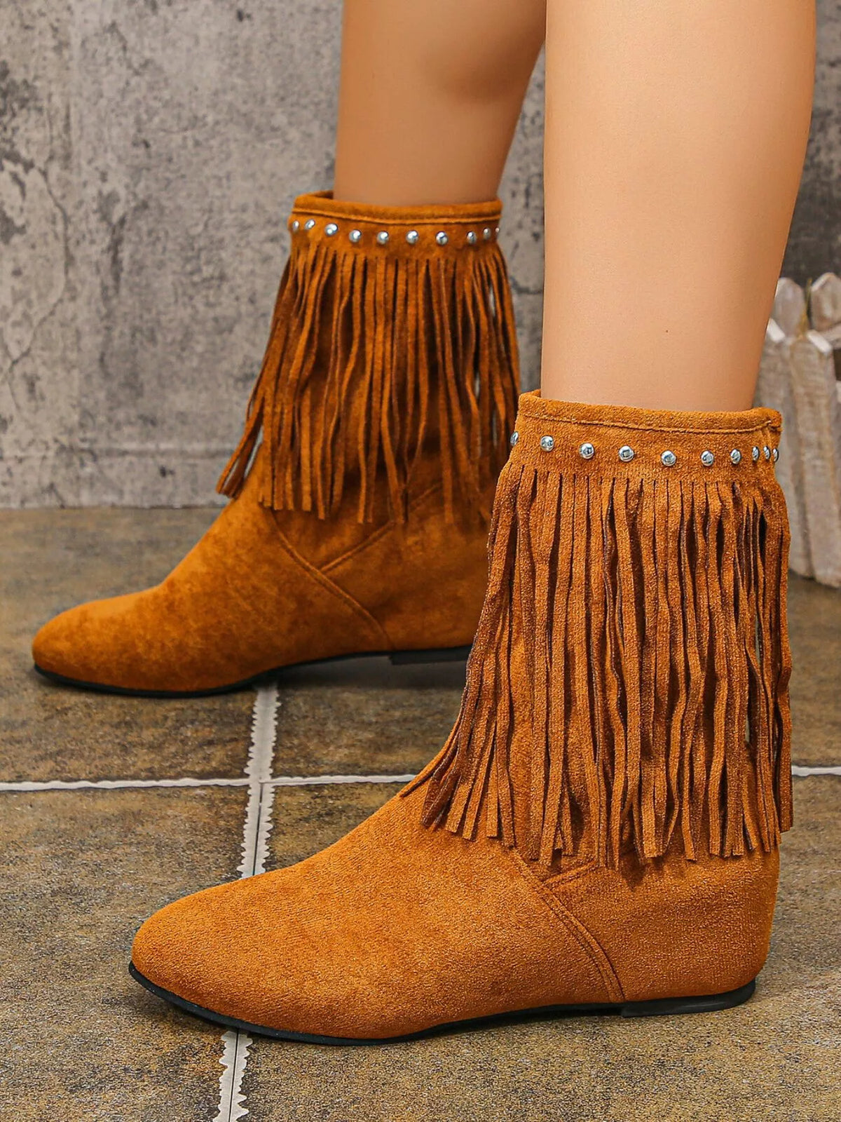 Studded fringe boots heel detail