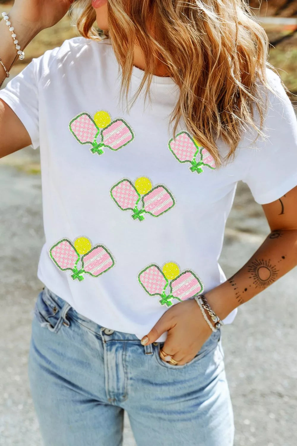White sequin pickleball short sleeve tee styled on model