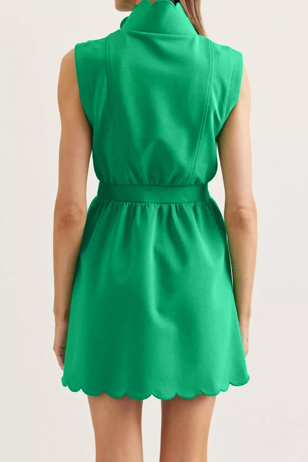 Back view of green sleeveless mini dress