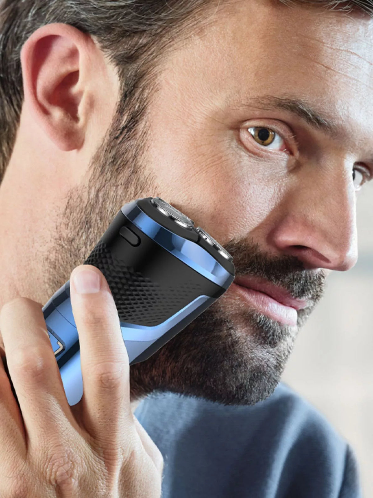Blue cordless rotary electric shaver front view