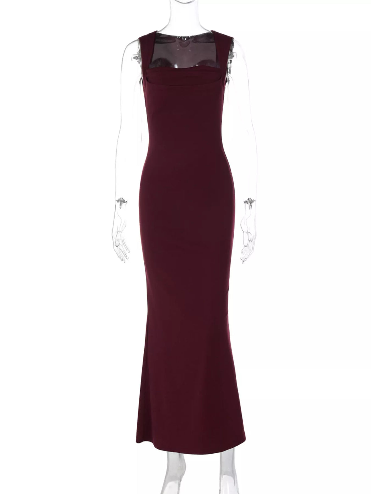 Long sleeveless dress worn with a jacket layered over