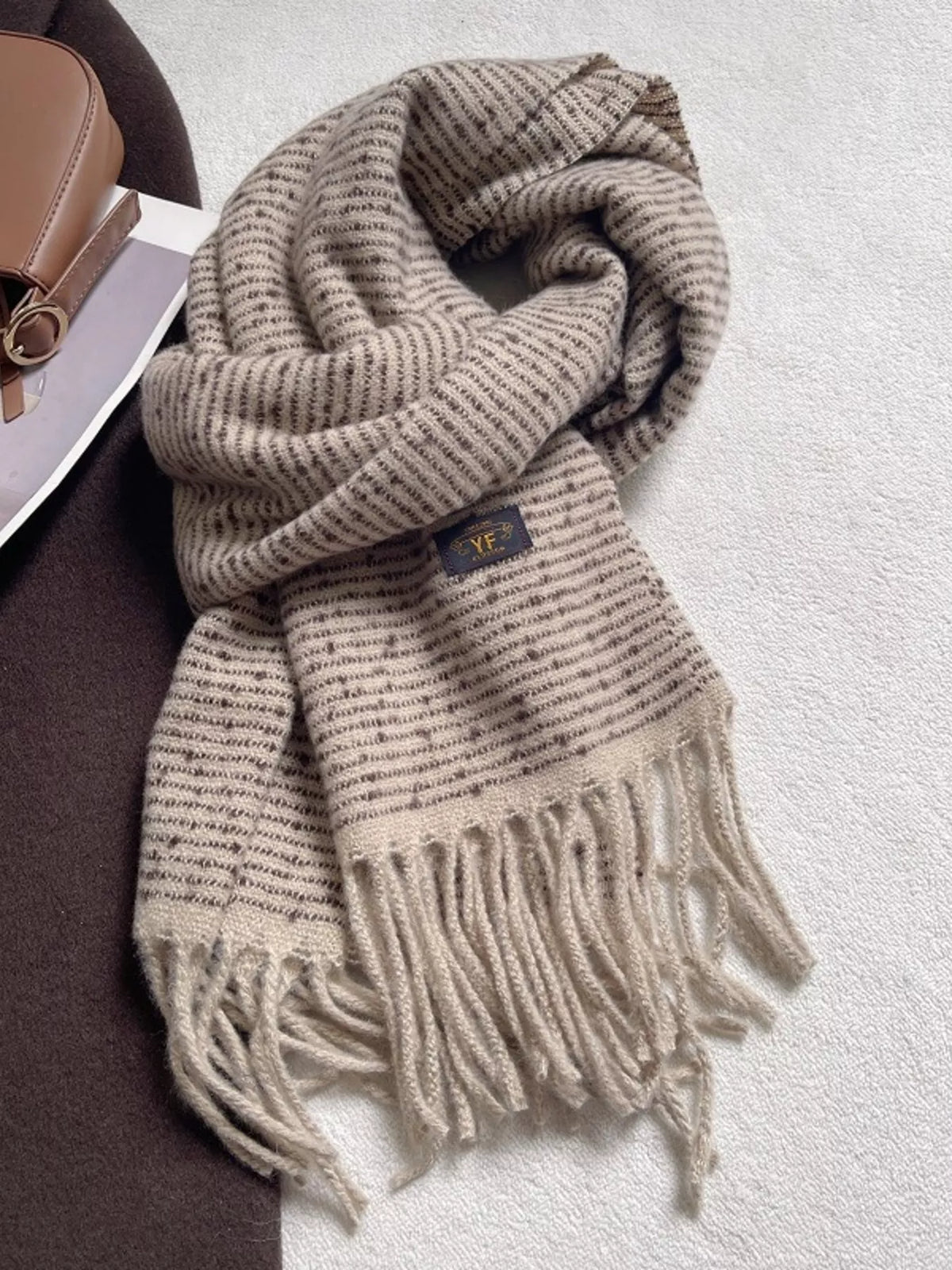 Tassel ends of the striped scarf