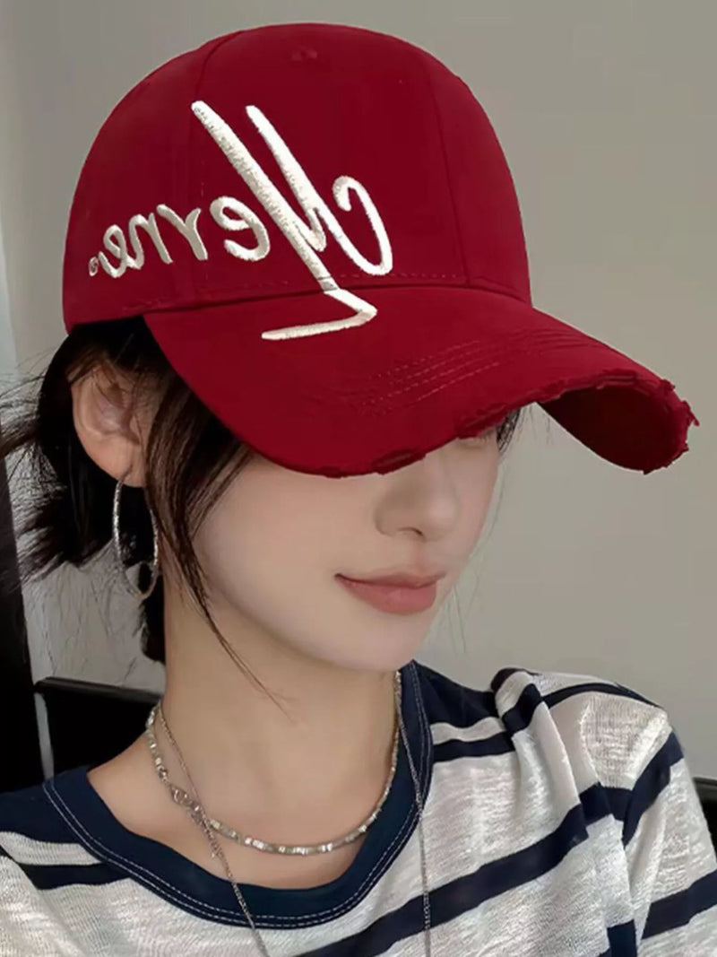 Burgundy baseball cap with script embroidery and frayed brim