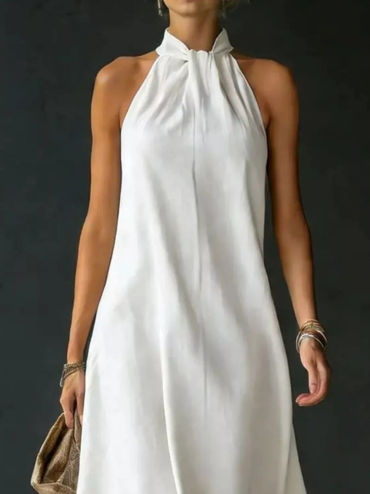 Side view of long halter maxi dress showing drape