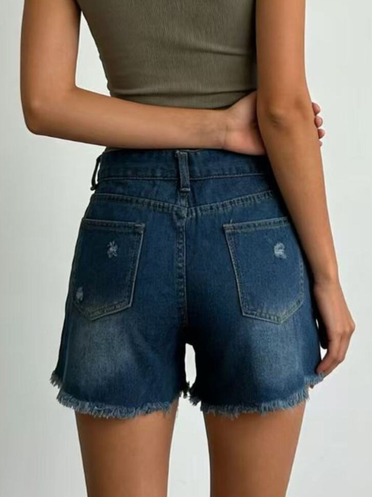 Light wash denim shorts styled with a white tee