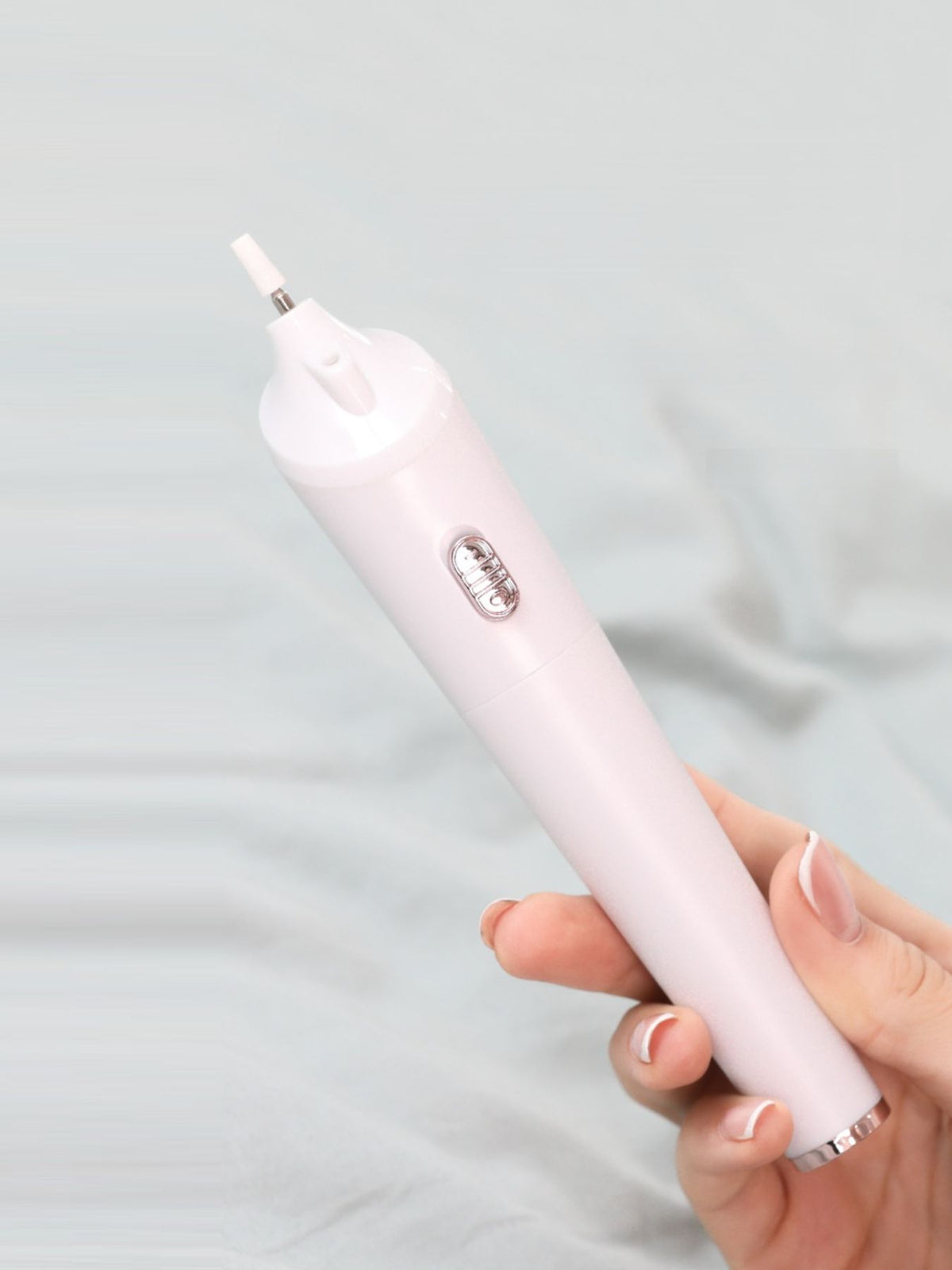 Nail buffer with attachment heads