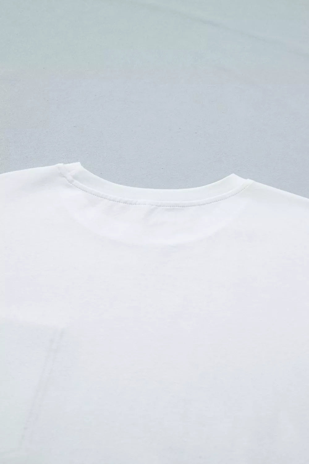 White color block short sleeve top with chest pocket back view