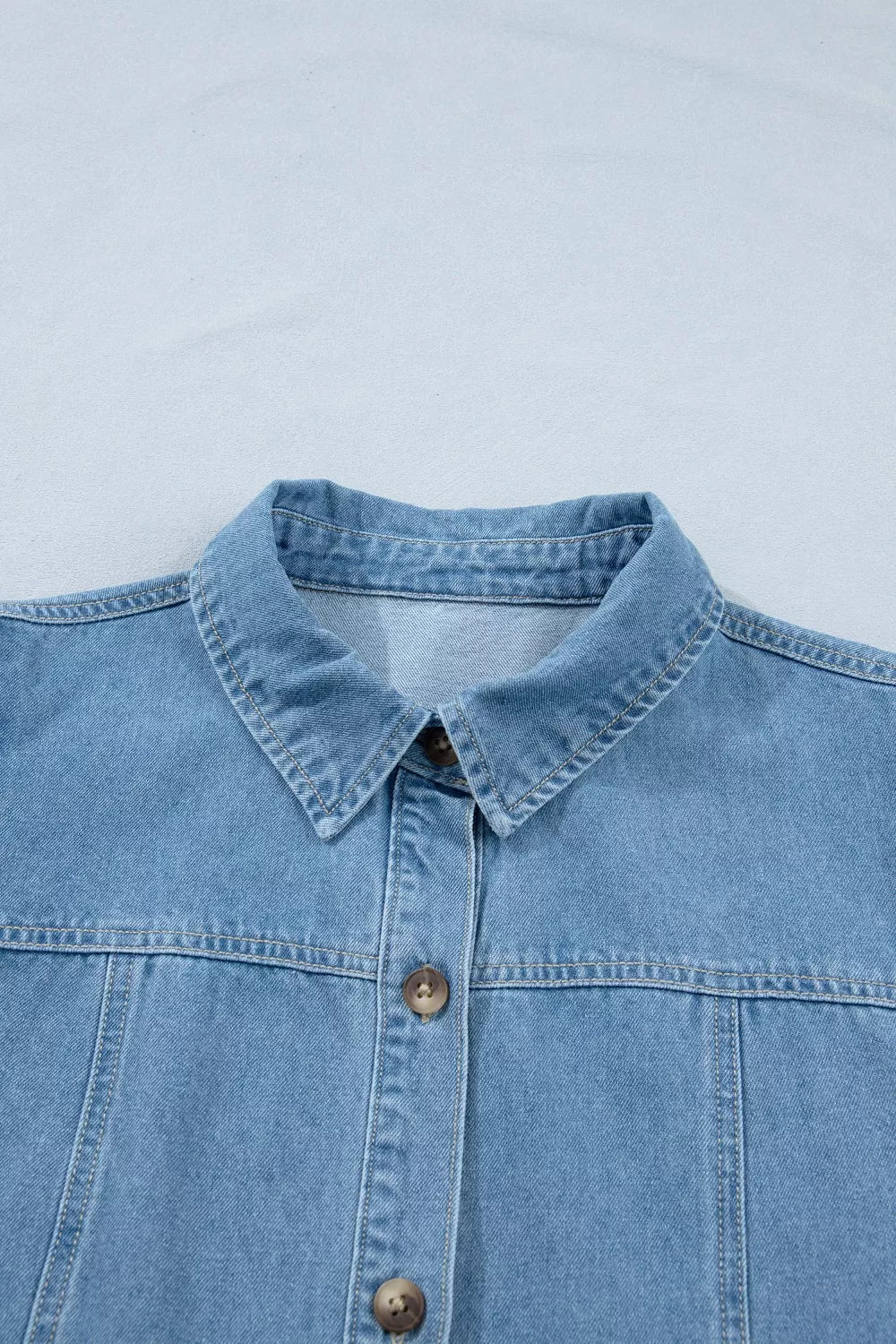 light wash puff sleeve ruffle hem denim dress fabric detail