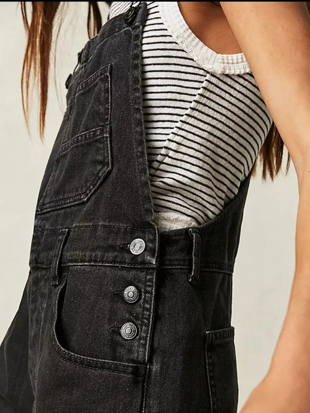 Black denim overall dress side and pocket detail