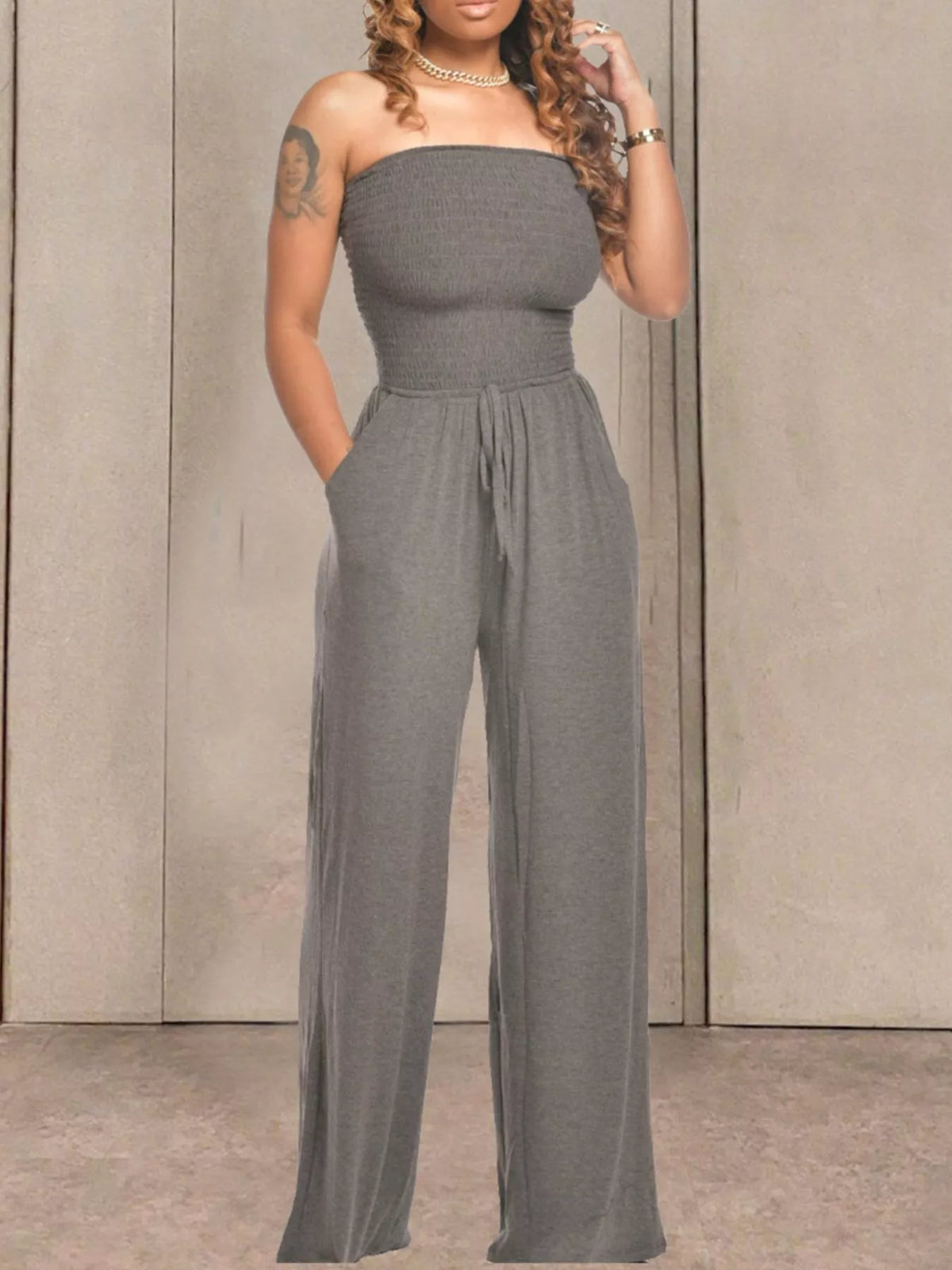 Apricot strapless smocked wide leg jumpsuit side view