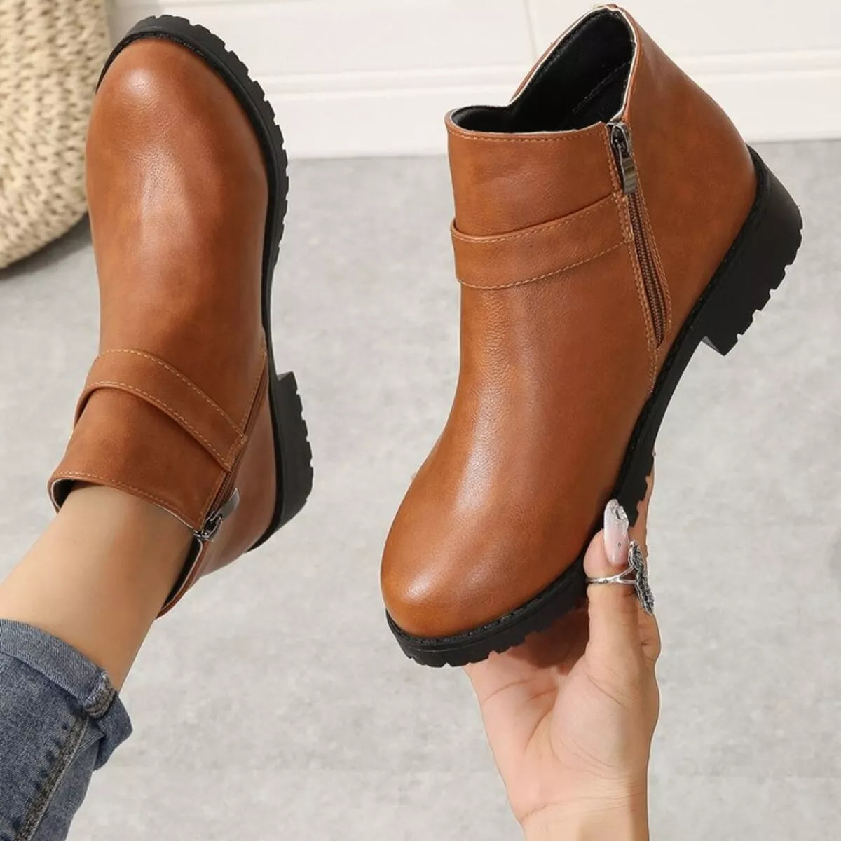 Buckle accent ankle boots sole and outsole view