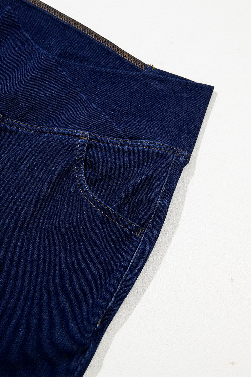 Dark navy flare jeans standing pose