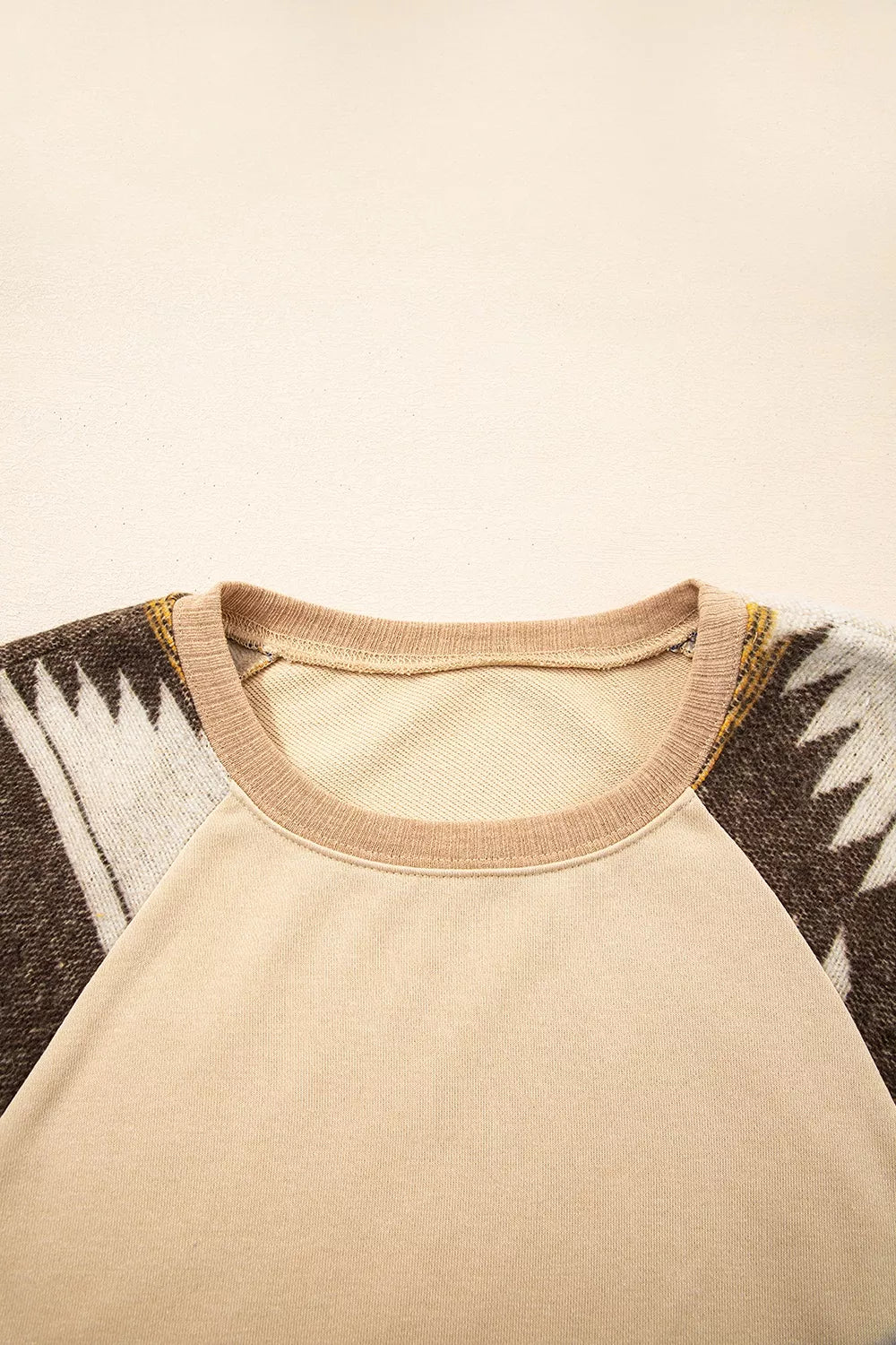 Sequined western sweatshirt shown from the shoulder down
