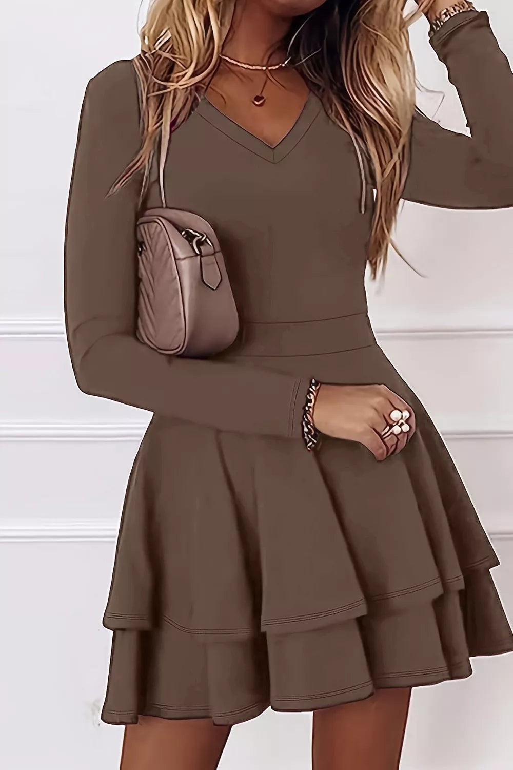 Layered long sleeve v neck mini dress front view on model
