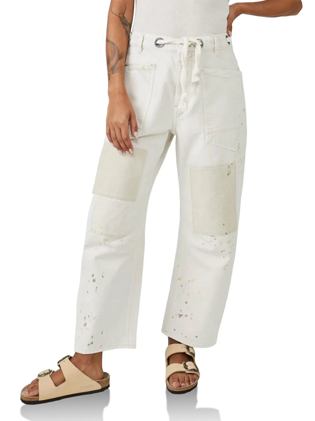 Relaxed washed jeans standing pose