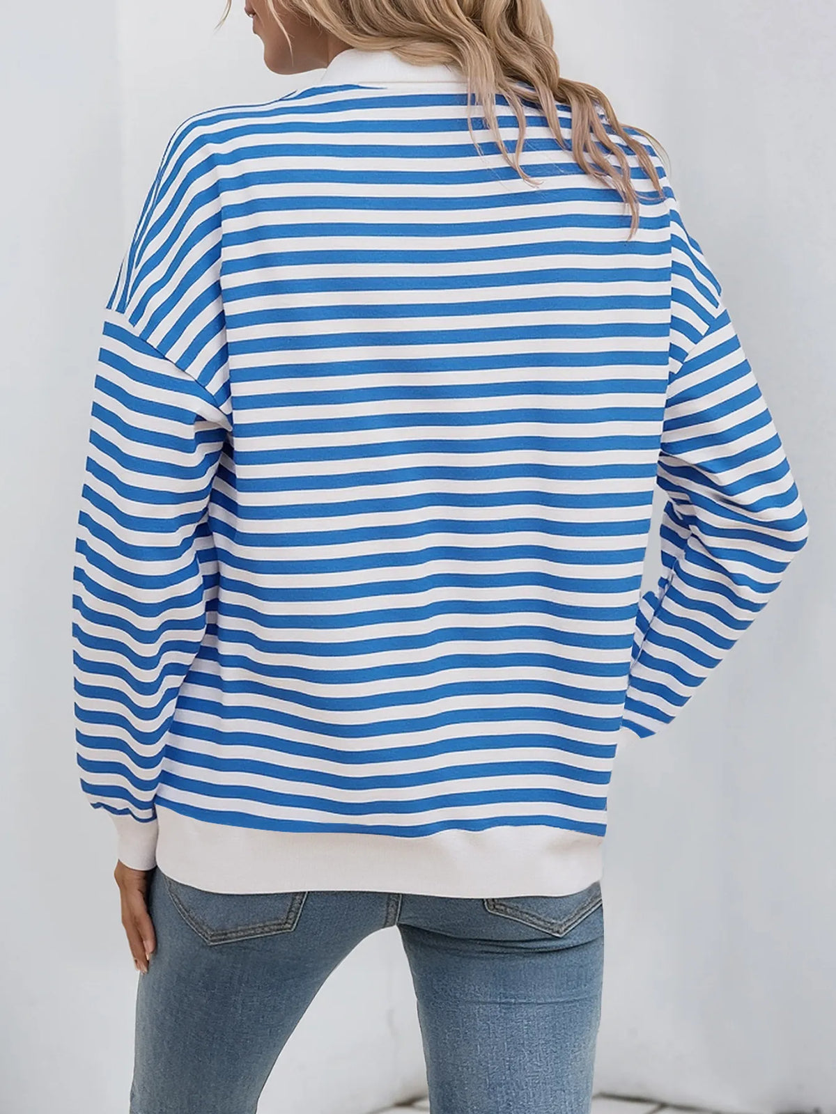 Drawstring hood detail on striped hoodie