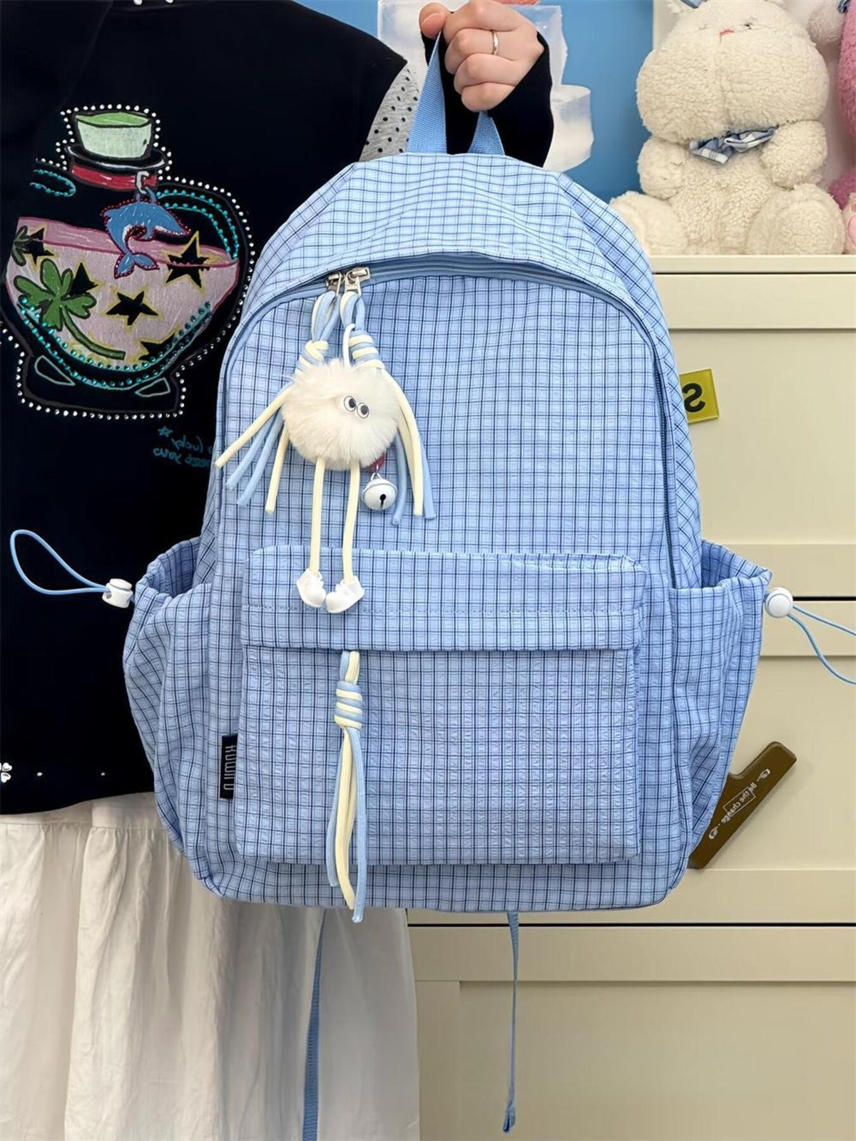 Plaid nylon backpack shoulder strap detail