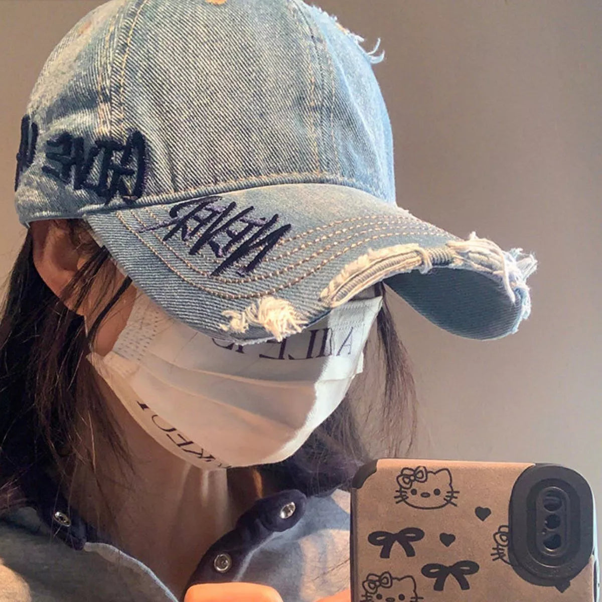 Front view of the distressed letter baseball cap