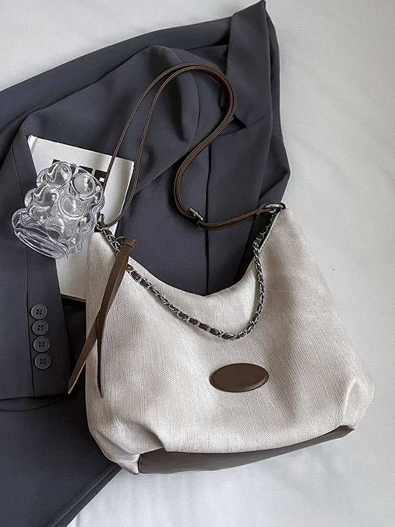 White canvas chain decor shoulder bag front view