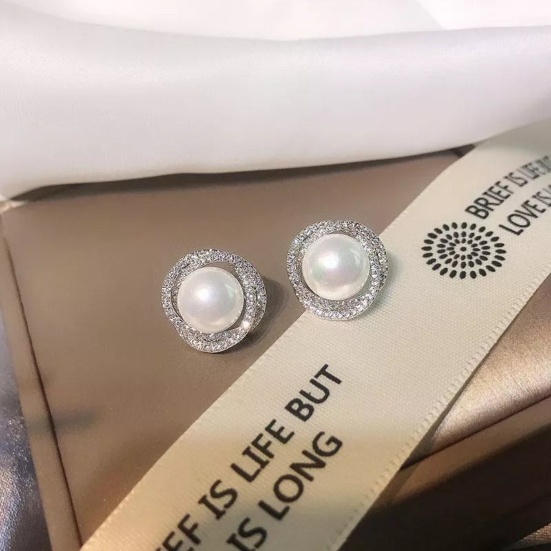 Pearl stud earrings styled