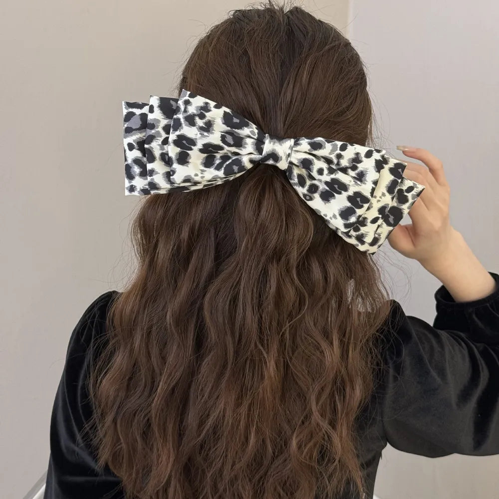Leopard bow hair clip styled in hair