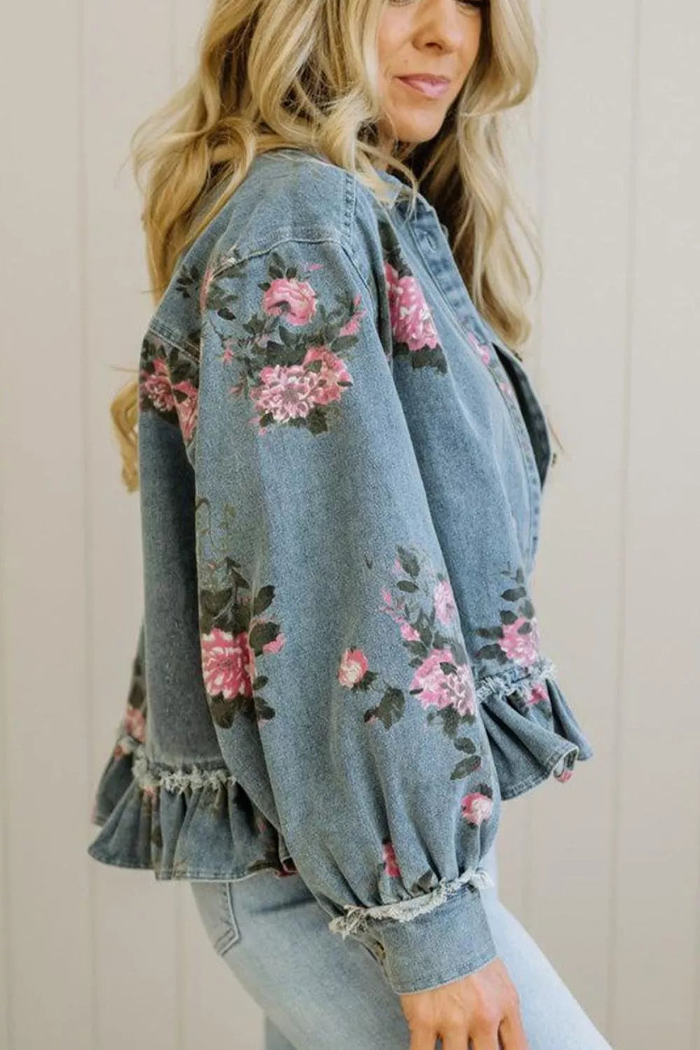 Close up of the raw edged ruffle hem on the denim jacket