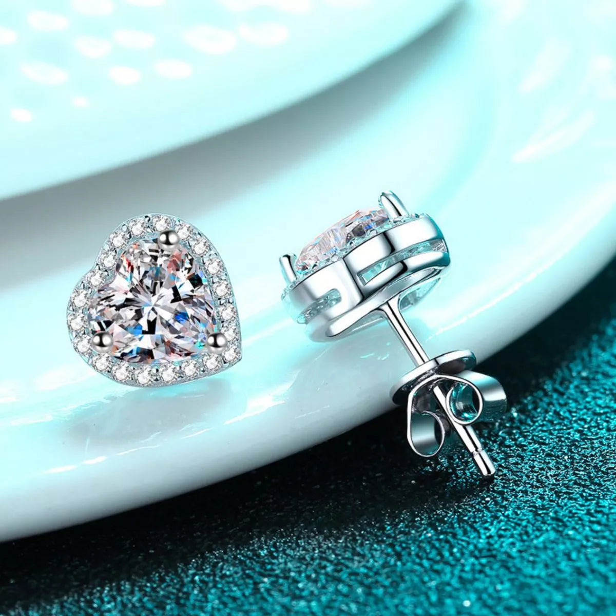 Heart shaped moissanite sterling silver stud earrings styled view