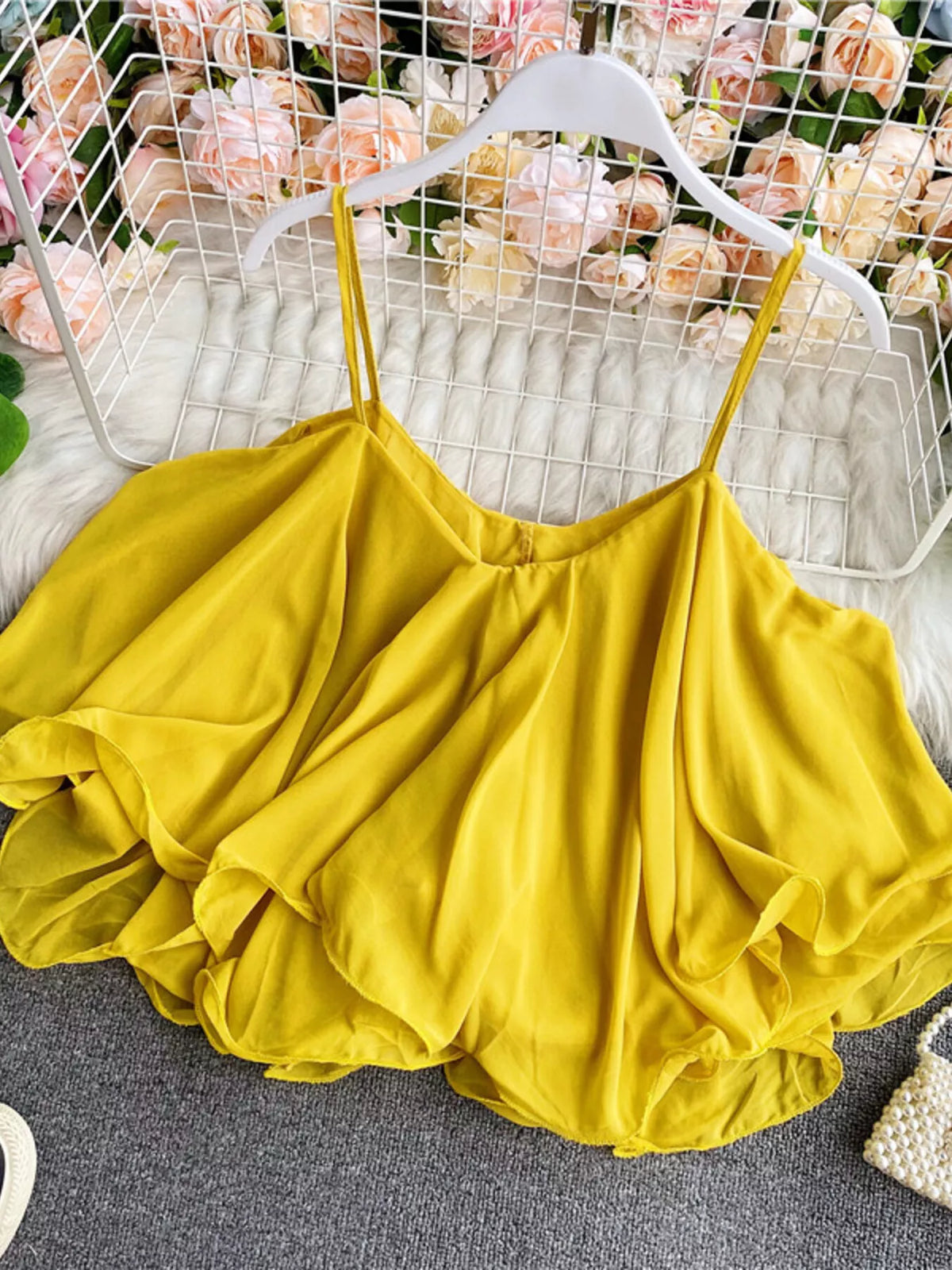 Ruffled flowy cami top side view
