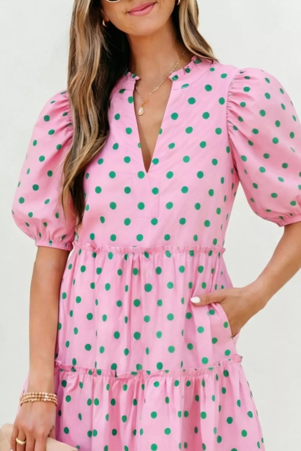 Blush pink polka dot tiered mini dress back view