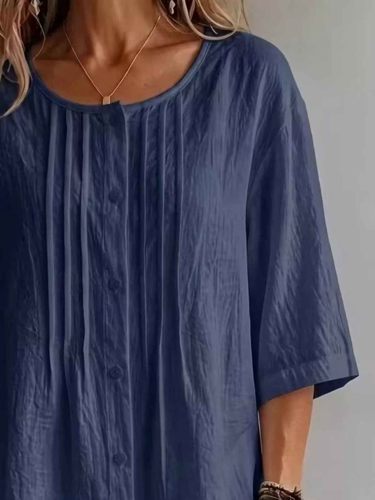 Blouse button and neckline detail