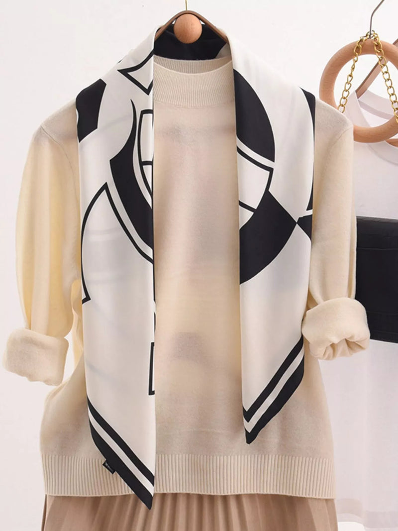 Square floral silky scarf tied at the neck
