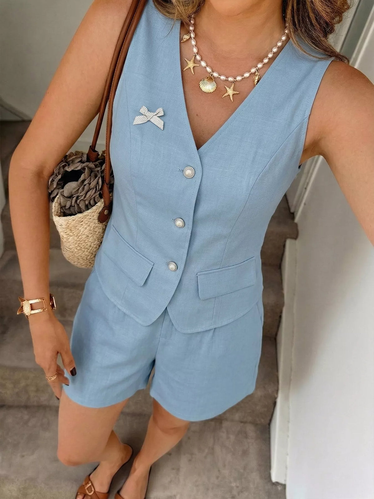 Blue button up vest detail