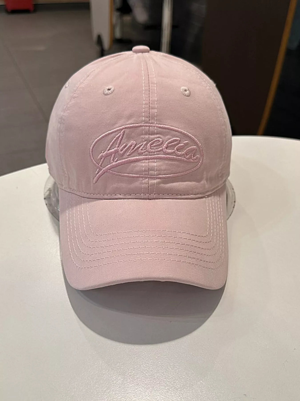 Back view of the embroidered cap showing the closure