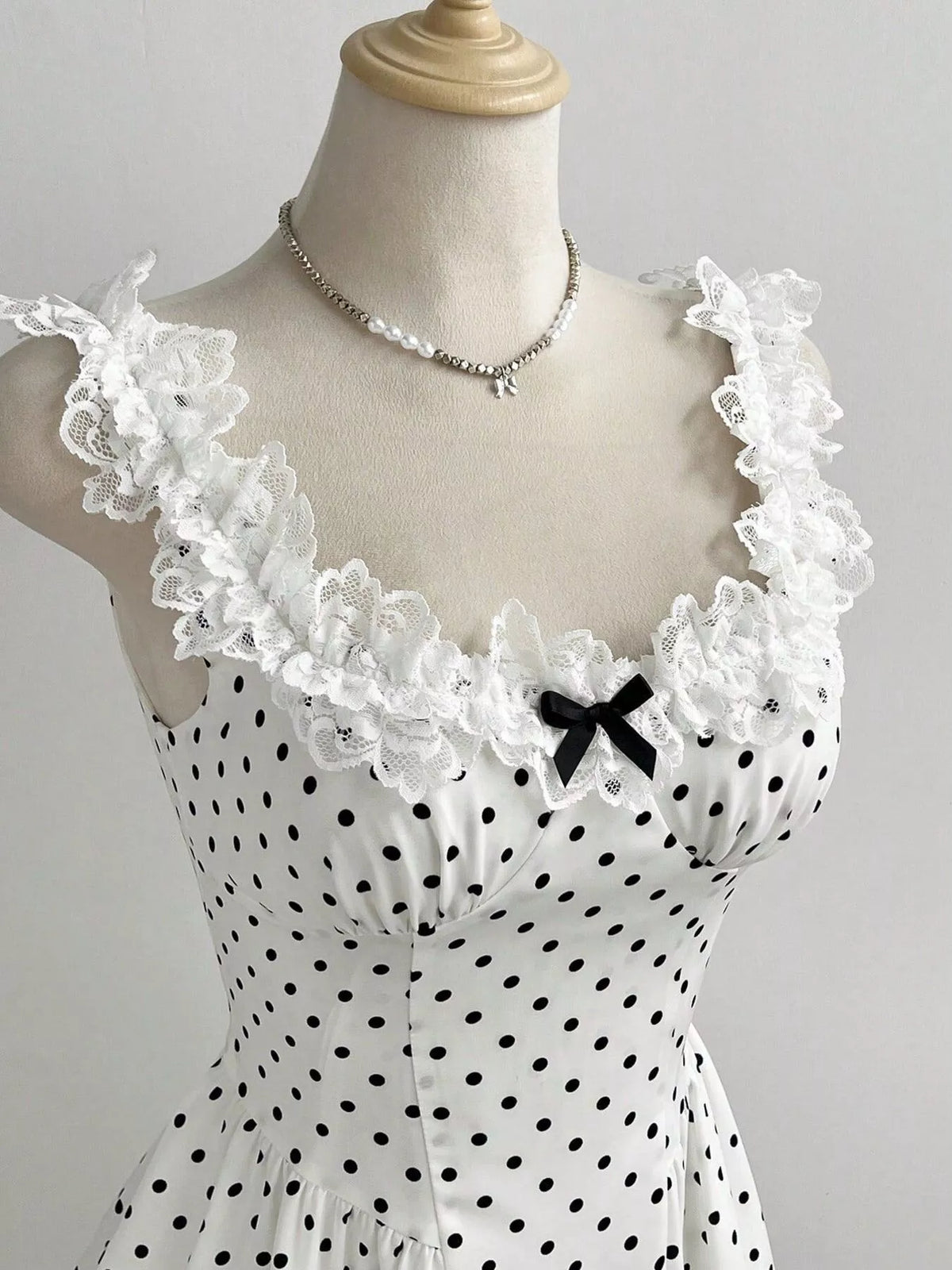 Polka dot mini dress side view showing short length