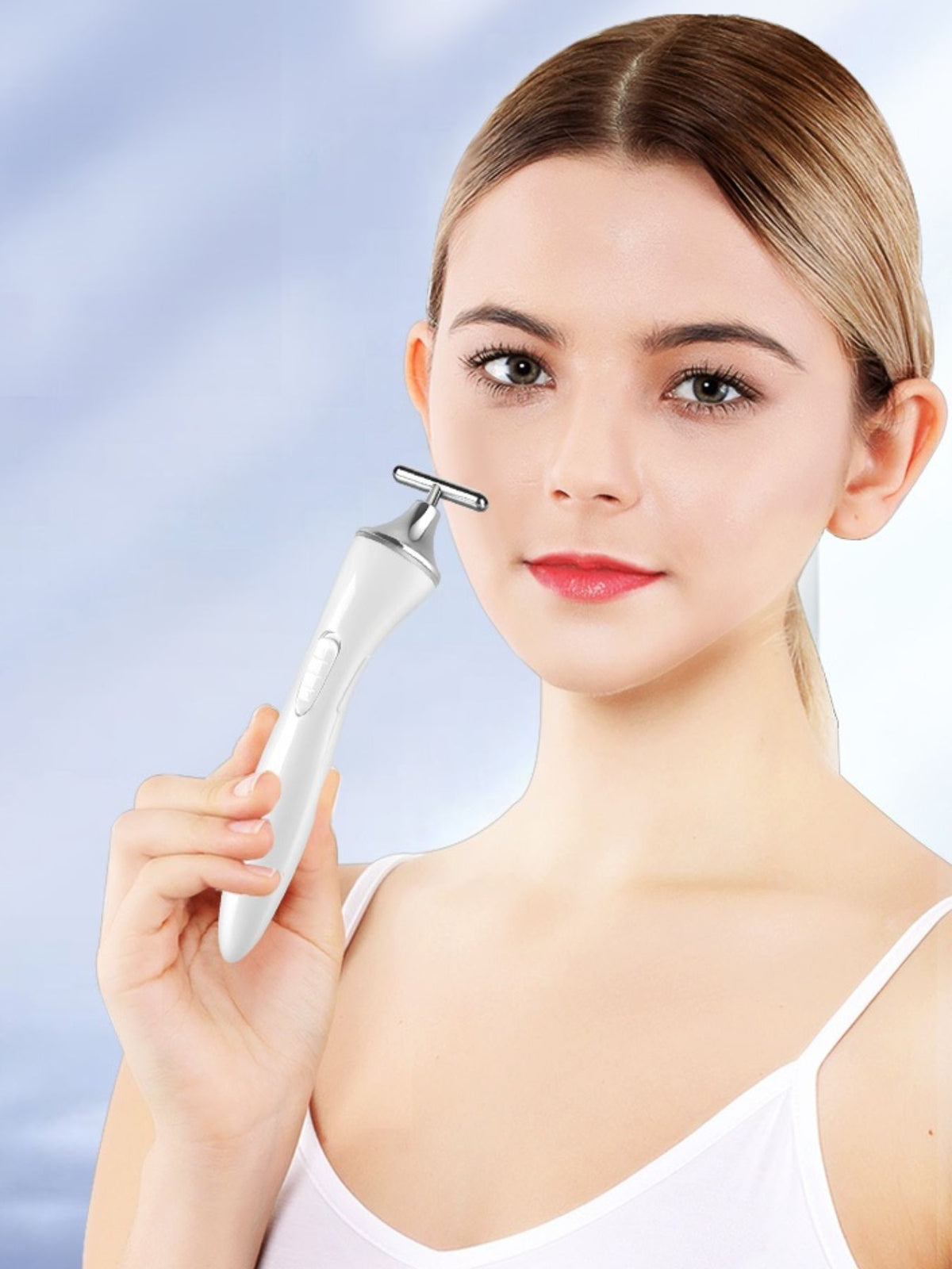 Facial massager used on cheek