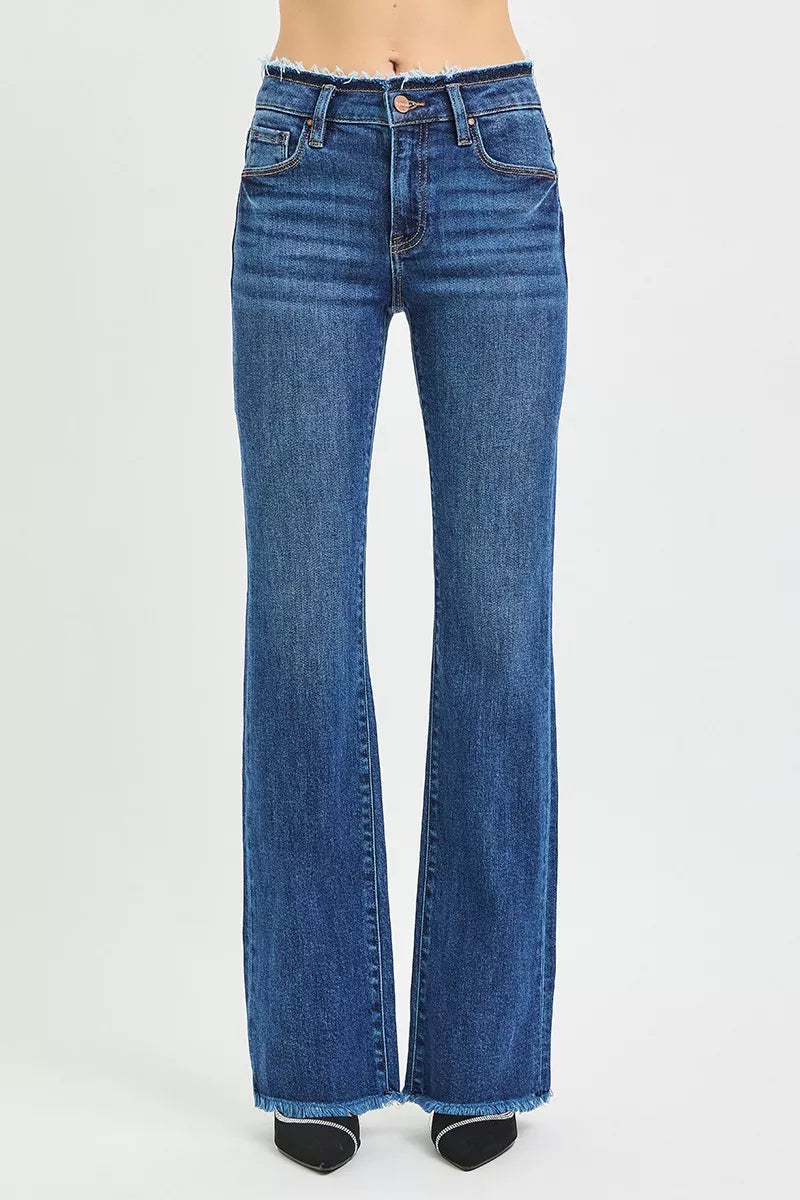 Dark wash bootcut denim raw frayed hem close up