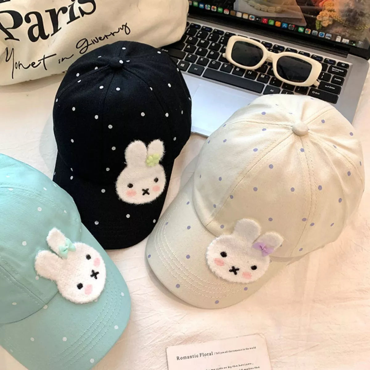 Polka dot cap shown from the side with curved brim