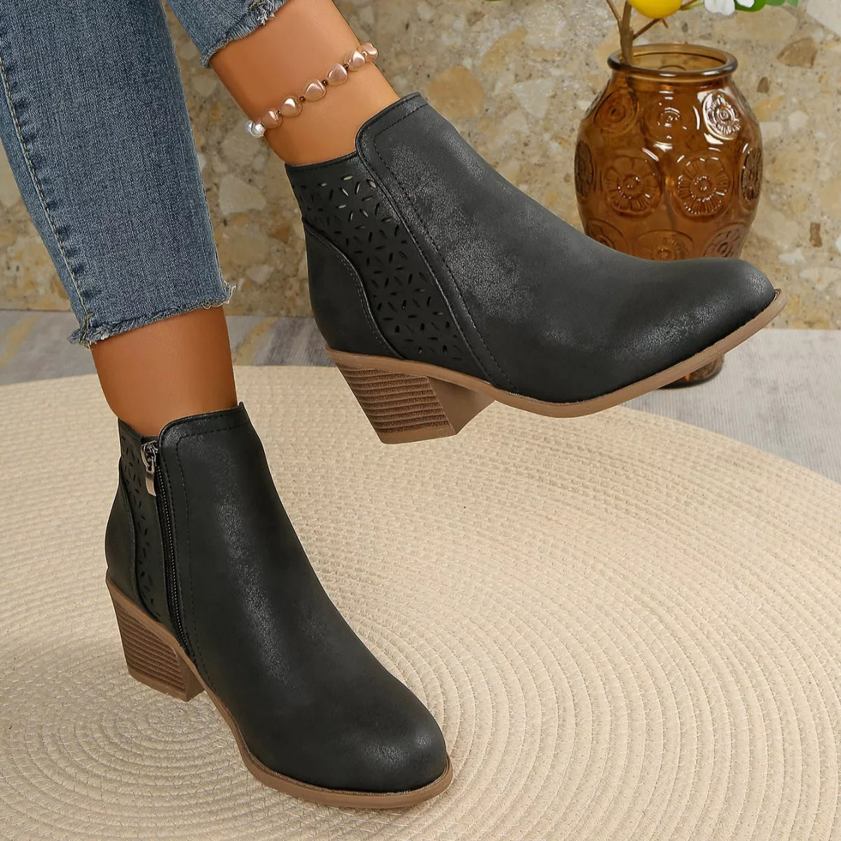 Point toe block heel boots pair styled together