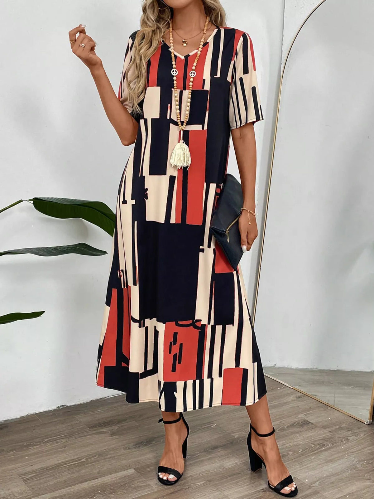 Abstract geometric print v neck midi dress full length view