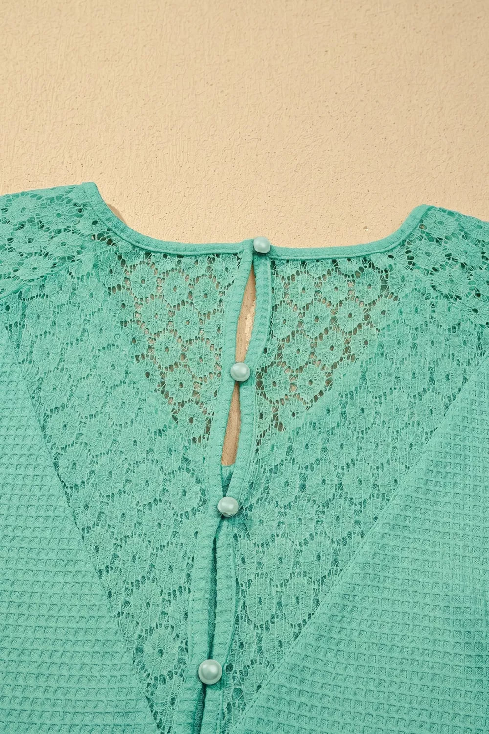 Turquoise waffle knit v neck top with lace trim front view