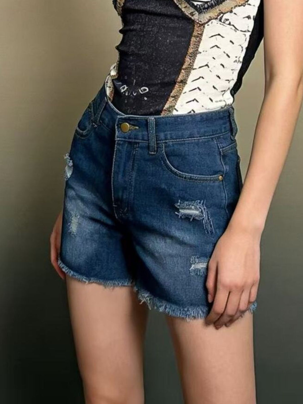 Back view of the distressed denim shorts