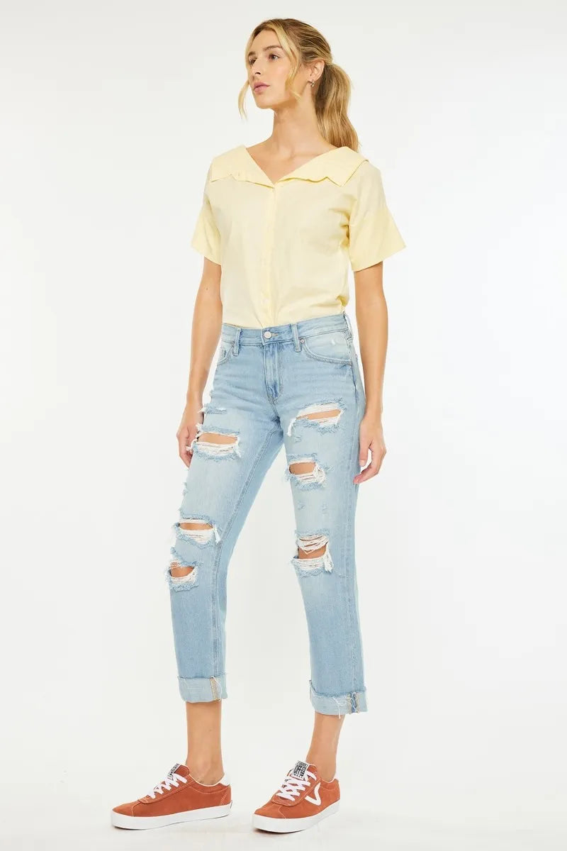 Distressing detail on light wash boyfriend jeans