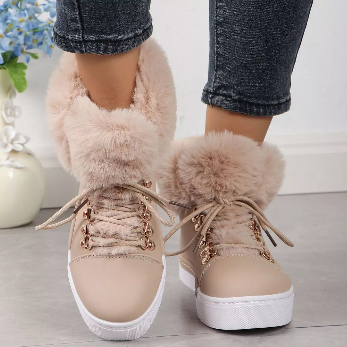 Fuzzy trim lace up ankle boots styled with denim