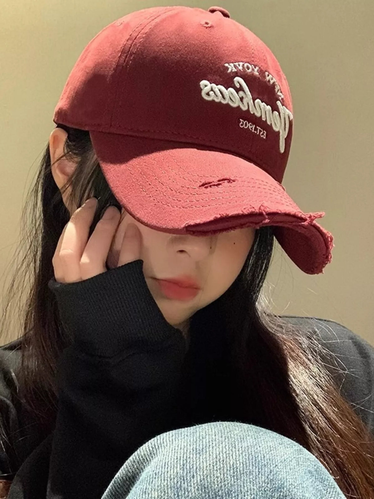 Wine red baseball cap shown from above